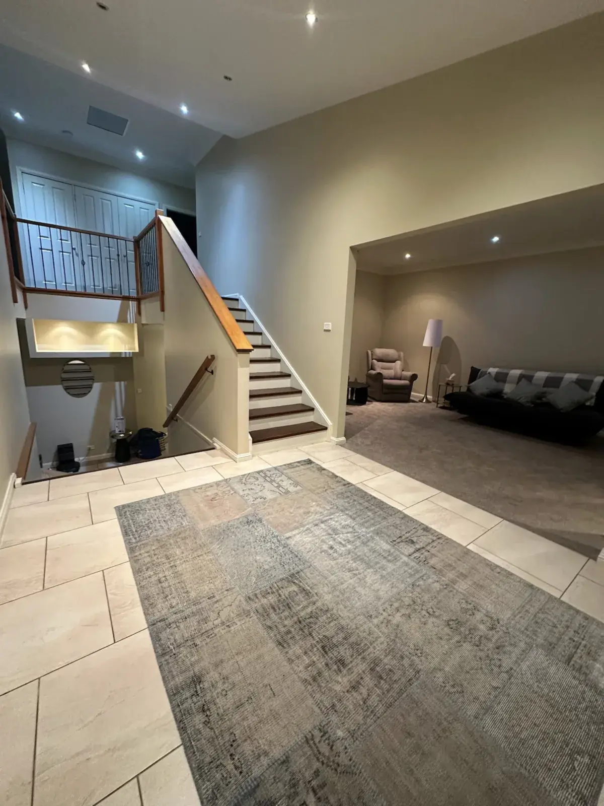 Heritage entry hall with staircase and lounge nook